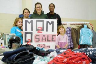 L-r Elizabeth Ross, Tanya Whan, Jennifer Ross, Kim Bates and Rachel Ross set up for the first ever Mom to Mom Sale at St. James Major Catholic School in Sharbot Lake.